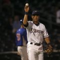 Northwest Arkansas third baseman Anthony Seratelli tosses a foul ball back to an umpire during Wedne...