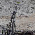 Workers operate a drill in the rescue effort for 33 miners trapped in the collapsed San Jose mine in...