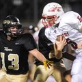 Fayetteville Ramay’s Aaron Kildow runs the ball Thursday while being pursued by Bentonville Gold’s P...