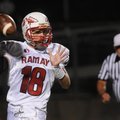 Ramay’s Daniel Shimer looks for a receiver Thursday while taking on Bentonville Gold in Tiger Stadiu...