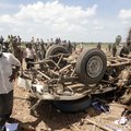 Sri Lankan police officers inspect the site of an explosion at a police station in Karadiyanaru, a s...