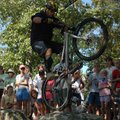 Spectators watch while a rider works over an obstacle during the trials competition at the Northwest...