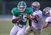 #15 Jacob Jenkins of Van Buren breaks a tackle attempt of #10 John Colliver of Harrison.