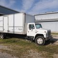 The advertisement on the side of the moving van calls Rogers Transfer & Storage the city's oldest ex...