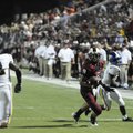  Springdale High’s Henry Hernandez moves past North Little Rock’s Devin Conley, right, and looks to ...