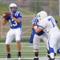 Rogers’ Nick Wary looks for an open receiver Friday against Harrisonville, Mo., in Rogers High Schoo...