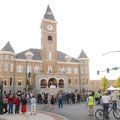 JOB COMPLETE - Visitors gather Saturday in front of the Historic Washington County Courthouse during...