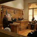 Circuit Judge Mary Ann Gunn receives a picture of the historic Washington County Courthouse in Fayet...