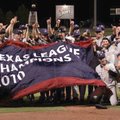 The Northwest Arkansas Naturals hold up the Texas League Championship Banner on Saturday night after...