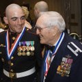 Marine Staff Sergeant Anthony Viggiani, left, with retired Air Force Colonel and Medal of Honor reci...
