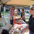 Music Professor Steve Cooper, right, serves dessert to a long line of people at NorthWest Arkansas C...