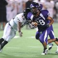 Fayetteville sophomore running back Brice Gahagans carries the ball through the Jonesboro defense du...