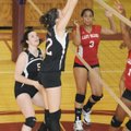 Springdale High’s Brittany Powers blocks the ball as Courtney Shaw, left, looks on during Tuesday’s ...