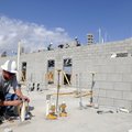Doyle Baker with Fayetteville Mechanical cuts the end of a copper pipe Wednesday while installing pl...