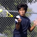 Springdale Har-Ber’s Eric Rodriquez returns a volley during practice Wednesday at the Tyson Sports C...