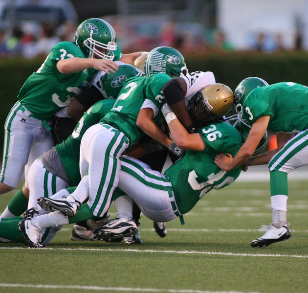 the-van-buren-defense-led-by-2-cole-plunkett-and-36-garrett-hightower-wrap-up-33-reese-tyree-of-little-rock-central