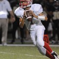 Springdale George Hunter Sargent looks downfield Thursday while taking on Bentonville Black in Tiger...