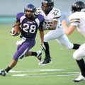 Fayetteville sophomore running back Brice Gahagans (28) carries the ball as Jonesboro junior defende...
