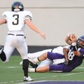 Fayetteville senior quarterback Brandon Allen scores while being tackled by Jonesboro junior Ty Lewi...