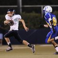 Rogers Heritage’s Josh Qualls picks up yardage as Springdale Central’s Tyler Horstman, right, pursue...