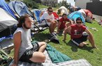 University of Arkansas students (from left) J.P. Turchi, Jacob Parker, Chris Wendel and Juan Oseguera hang out in front of their tents Friday as they talk about Saturday’s game between the Razorbacks and No. 1-ranked Alabama. 
