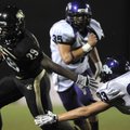 Bentonville running back Tearris Wallace breaks free from Fayetteville’s Athen Brandon on his way to...