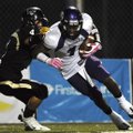 Bentonville defensive back Dakota Baggett attempts to tackle Fayetteville wide receiver Chris Smith ...