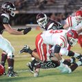 Farmington junior tailback Jared Martin carries the ball to the goal line as Gentry junior linebacke...