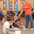 BOOK FAIR FUN - Rich Davis, a cartoonist from Siloam Springs, leads a group of children and adults i...