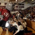 MEETING MASCOT - Big Dog, Springdale High School’s new mascot, slaps hands Friday with members of th...