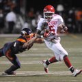  Fort Smith Northside’s Andonious Jones is dragged down Friday by Heritage High School’s Matt White ...