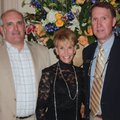Hostess Jeannie Fleeman stands with Hope Cancer Resources President and CEO Brian Holt, right, and H...