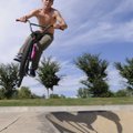 Miles Pulliam catches some air Monday while riding at the Walker Park skate park. The National Weath...