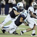 Springdale’s Henry Hernandez is tackled by Springdale Har-Ber’s Riley Gibson, middle, and Drew Lawso...