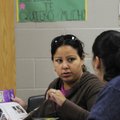Yesenia Cruz, left, speaks to Yesenia Calleros on Monday during the Toyota Literacy Program at J.O. ...