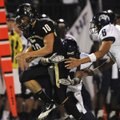 Bentonville quarterback Pearson Gean, left, is chased down by Fayetteville’s Colby Jordan, center, a...