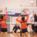 Fayetteville sophomore Hannah Pinter records a kill against Rogers Heritage junior Morgan Mitchell, ...