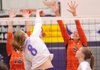 Fayetteville senior Morgan Cosby kills the ball past Rogers Heritage senior Shelby White, right, during the second game Tuesday at Fayetteville.