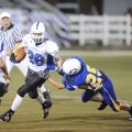 Fayetteville Woodland running back Drew Conlee is tackled by Springdale Central’s Tim Faubus during ...