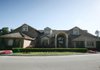 Bill Schwyhart’s home at 9 Club House Drive in Rogers is the subject of a lawsuit that accuses the developer of fraudulently transferring ownership of the house to his son and stepdaughter.
