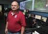Matthew Garrity, manager of Emergency Services for Benton County, stands Sept. 23 in central communications at the Benton County Administration Building in Bentonville. Garrity will be going to Saudi Arabia to teach people how to run dispatch centers.