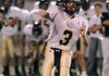 Bentonville Gold quarterback Jake Slocam throws a pass in the first half Sept. 30 against Fayetteville Woodland in Fayetteville.