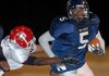 Little Rock Fair’s Benjamin Clark (5) eludes Little Rock McClellan’s Larry Young (left) during the War Eagles’ 7-0 victory over the Lions on Friday in Little Rock. 