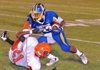 Hot Springs Lakeside senior running back Dennis Brunson runs over Malvern’s Javonte Jones earlier this season. 