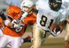 Bentonville Gold receiver Jimmy Jackson sprints away from Southwest Junior High’s Douglas Matthews during the first half Oct. 14 in Jarrell Williams Bulldog Stadium in Springdale.