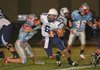 Springdale Har-Ber quarterback Ryan Luther (6) breaks a defender’s tackle in a 38-31 loss to Fort Smith Southside on Friday. Luther passed for 205 yards in the Wildcats’ first loss. 