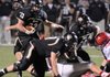 Bentonville running back Garrett Kaufman carries the ball on Oct. 22 against Fort Smith Northside in Tiger Stadium in Bentonville.
