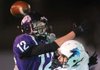 Fayetteville receiver Brad Culp (12) reaches to make a catch at the goal line as Springdale Har-Ber’s Preston Pianalto (5) defends in the second quarter at Fayetteville on Friday night. 
