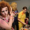  Blair Blankenship, 16, left, of Fayetteville, works on her hair Sunday while preparing for the Arts...