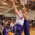 Fayetteville sophomore Tyler McCullough, center, scores on a layup Tuesday during the Purple-White s...